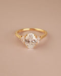 Trilogy Engagement ring with Oval shape Lab Grown diamond in the centre and Half moon side stones