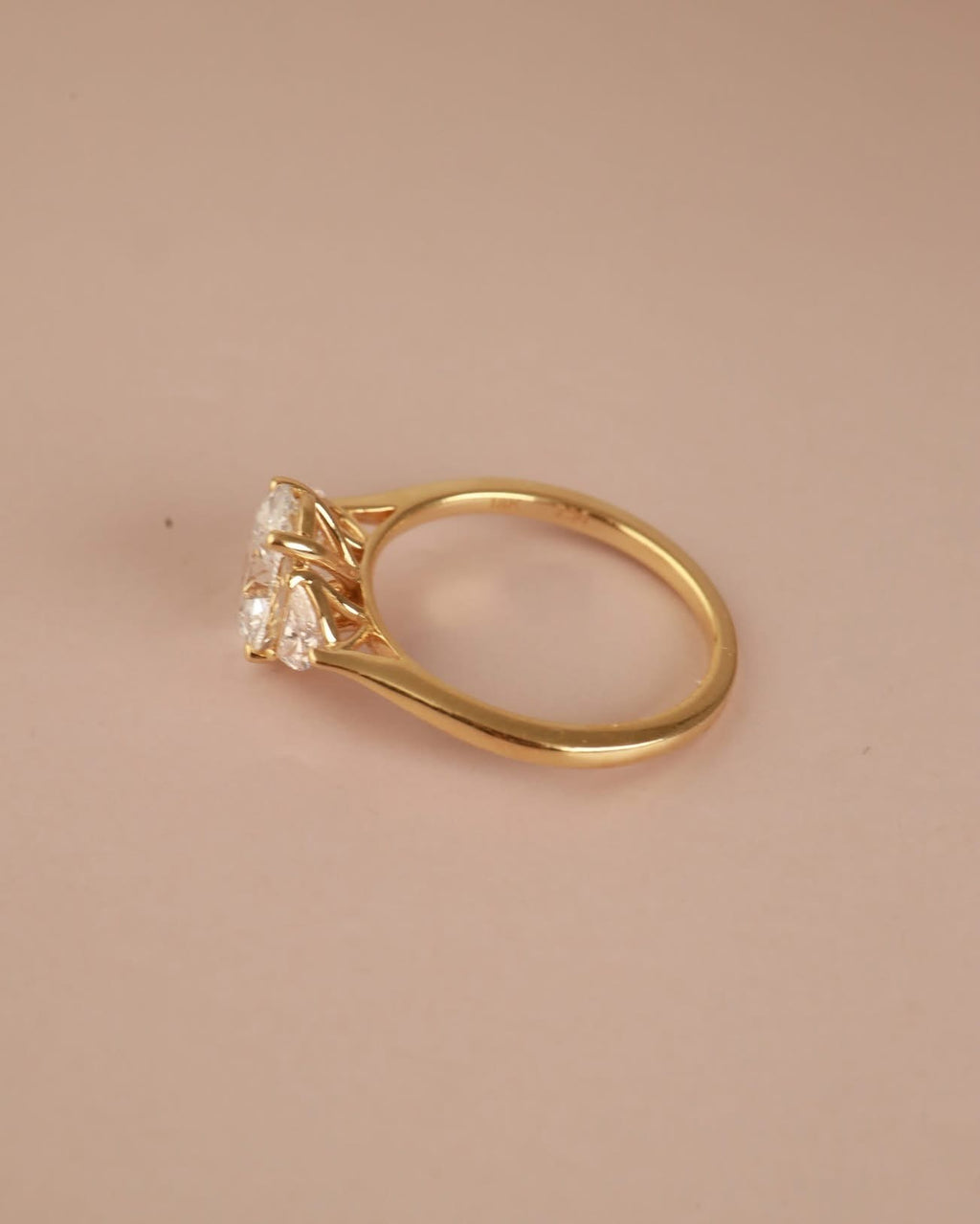 Trilogy Engagement ring with Oval shape Lab Grown diamond in the centre and Half moon side stones