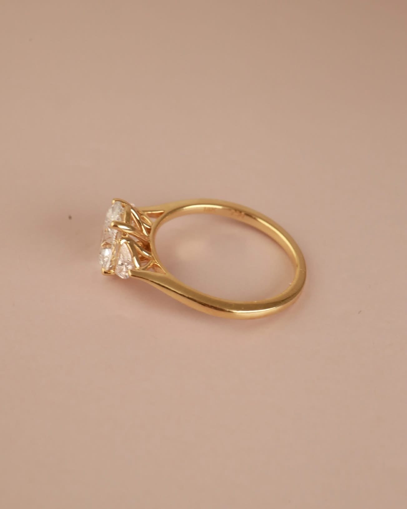 Trilogy Engagement ring with Oval shape Lab Grown diamond in the centre and Half moon side stones