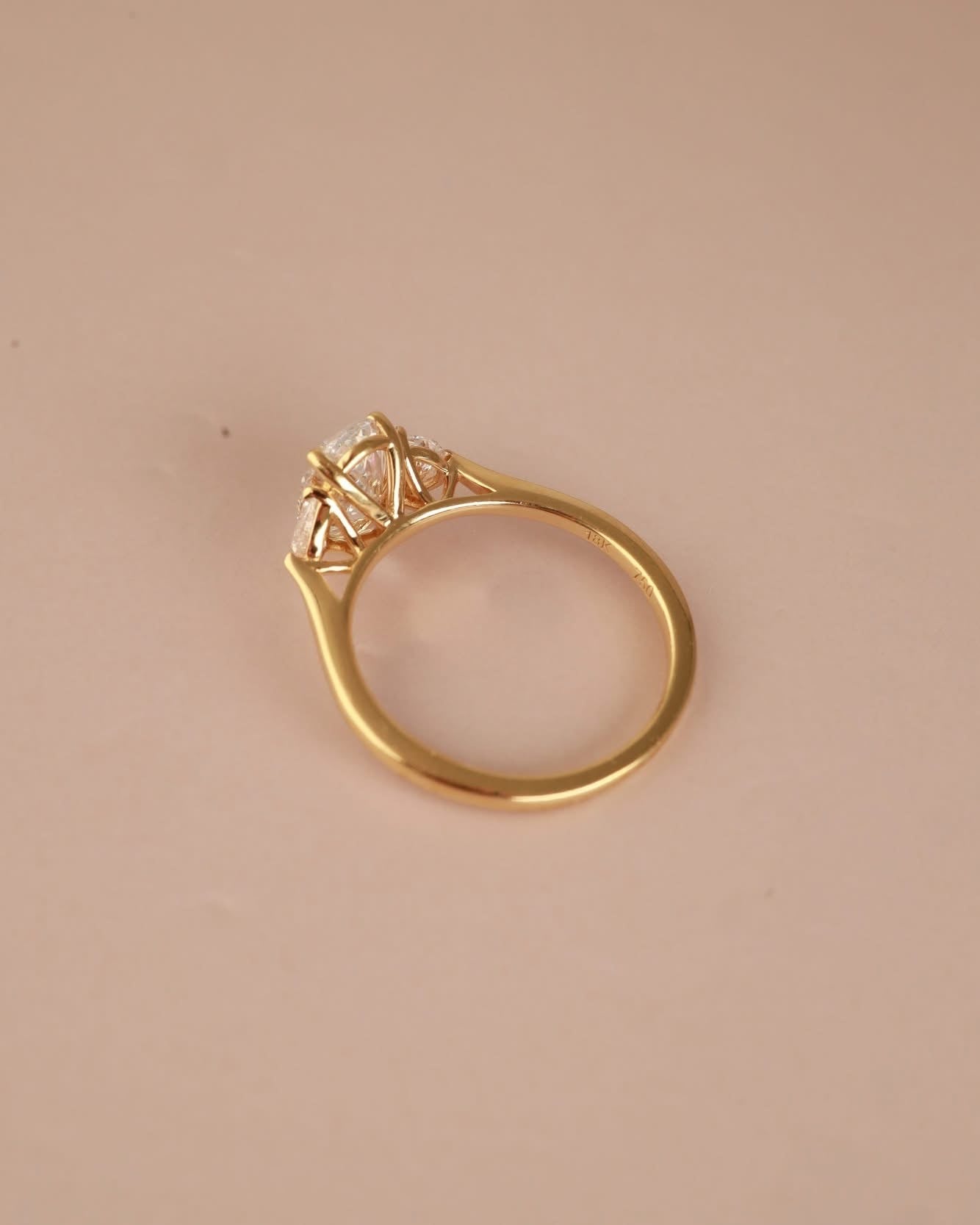Trilogy Engagement ring with Oval shape Lab Grown diamond in the centre and Half moon side stones