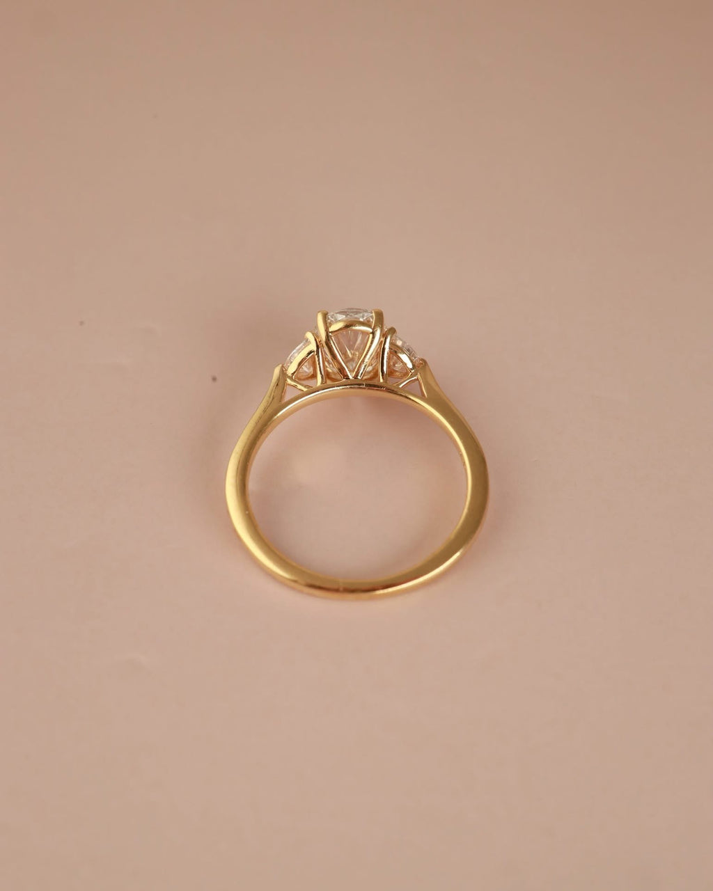Trilogy Engagement ring with Oval shape Lab Grown diamond in the centre and Half moon side stones