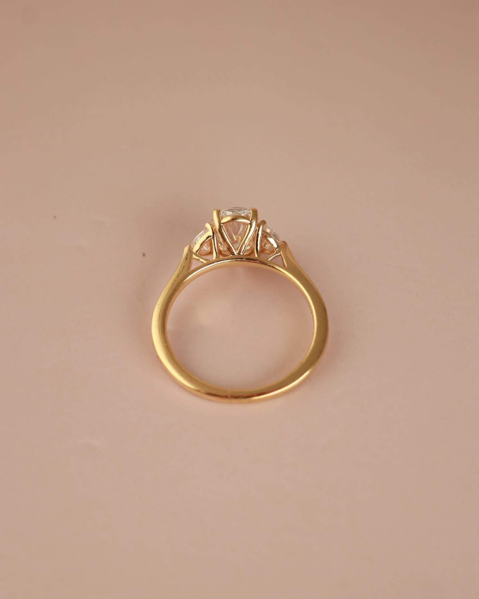 Trilogy Engagement ring with Oval shape Lab Grown diamond in the centre and Half moon side stones