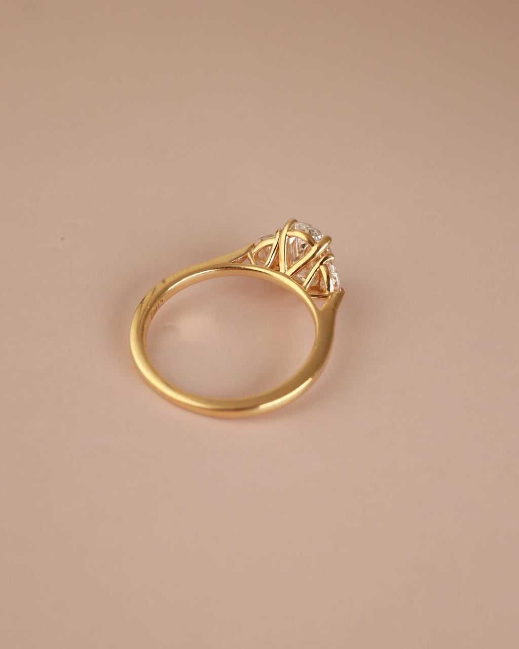 Trilogy Engagement ring with Oval shape Lab Grown diamond in the centre and Half moon side stones