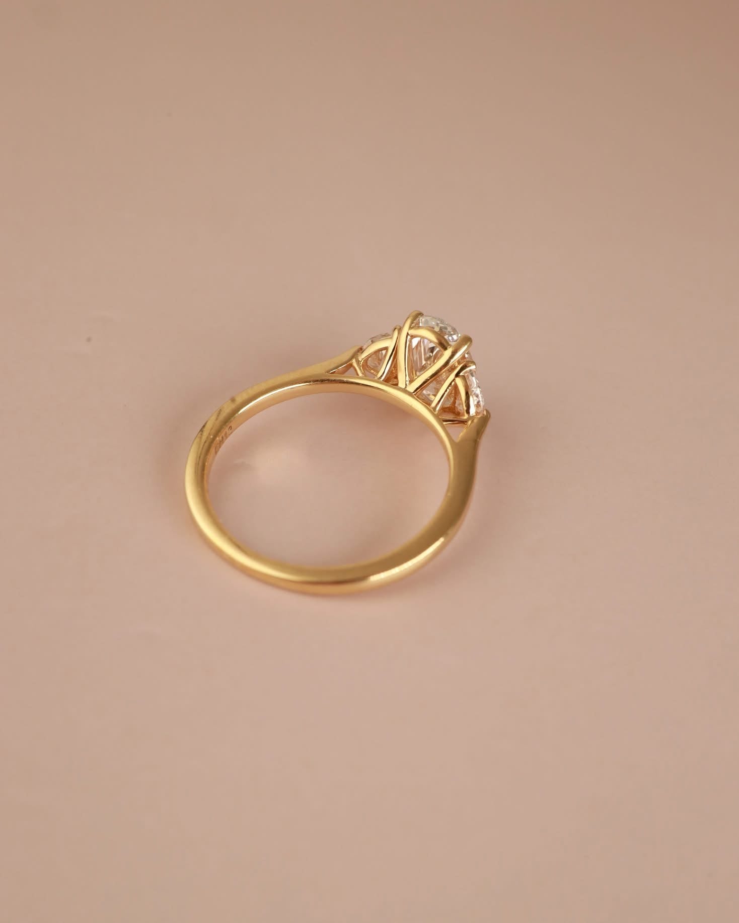 Trilogy Engagement ring with Oval shape Lab Grown diamond in the centre and Half moon side stones